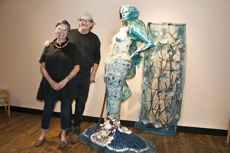  Artist Julia Schloss is pictured with Hill College art instructor Tom Sale at the latest art exhibit at the Hill College Texas Heritage Museum, ‘Earth Angels.’ 
